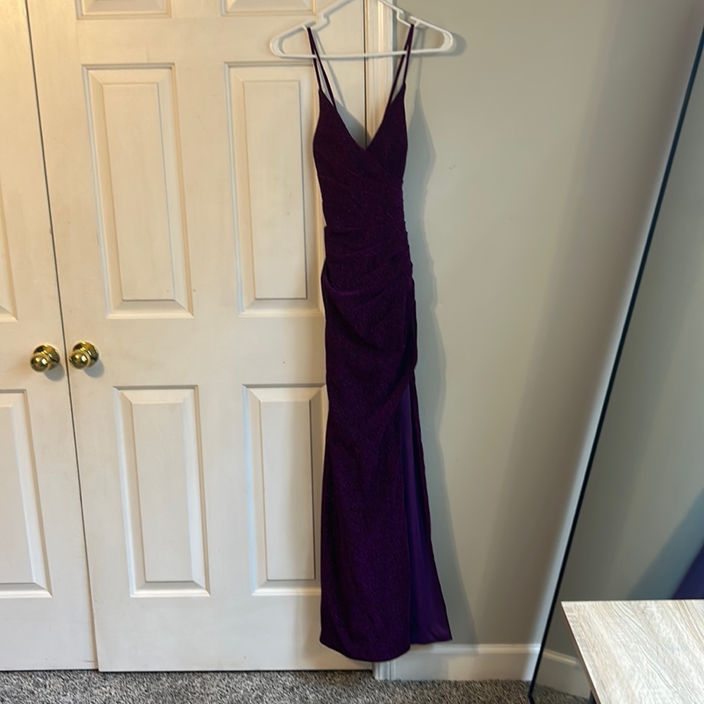 Brand new with tags. I ordered it and chose not to wear it to prom.